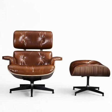 A mid-century modern brown leather lounge chair with a matching ottoman, both on black five-star bases, photographed against a clean white background.