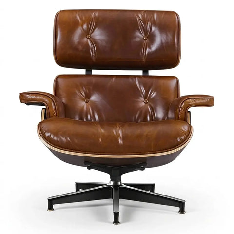 A classic mid-century modern lounge chair with a brown leather tufted seat and backrest, mounted on a black five-star metal base, photographed against a solid white background.